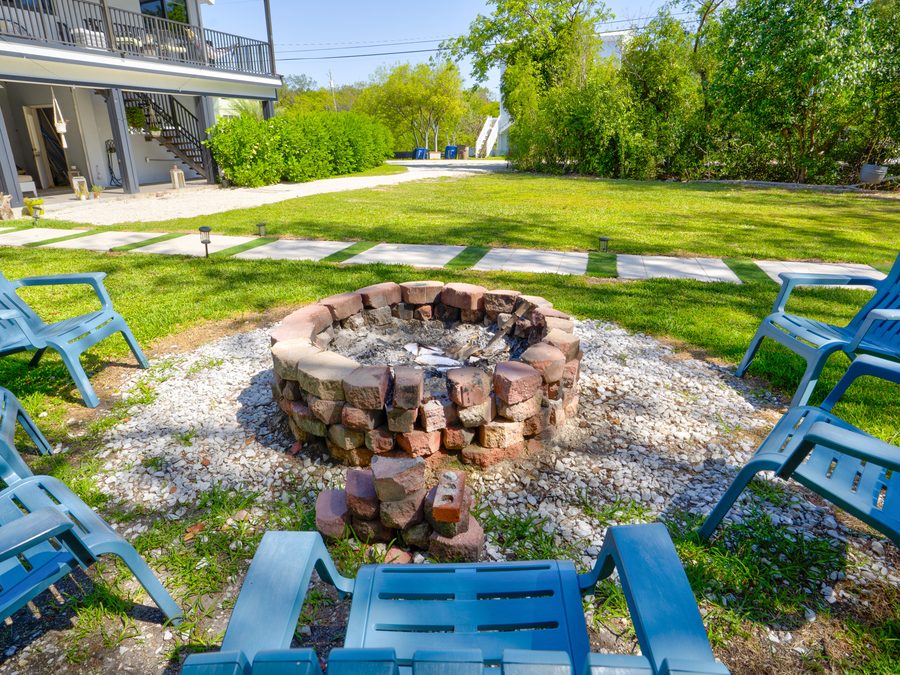 Fire pit and lounge area at Key Largo home — IMMERSE™ outdoor lifestyle