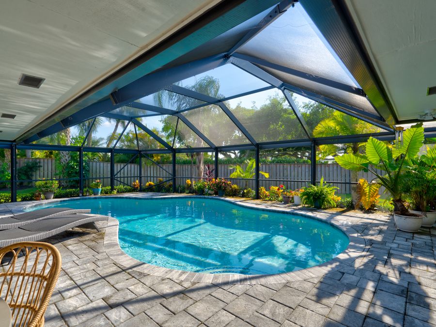 Coral Gables home with screened pool terrace